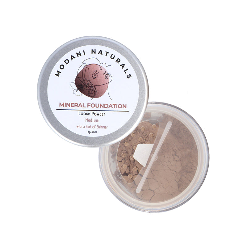 Modani-Foundation powder showing lid with lable and open product contents of powder on white background.