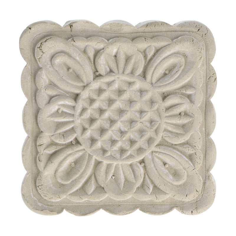 Green French Clay body cleanse and mask bar with intricate floral design by 'Modani Naturals' on a white background