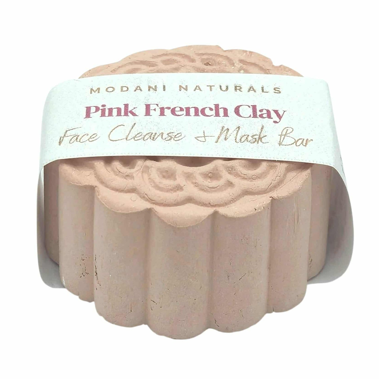 Pink French Clay face cleanse and mask bar with Modani Naturals packaging on a white background