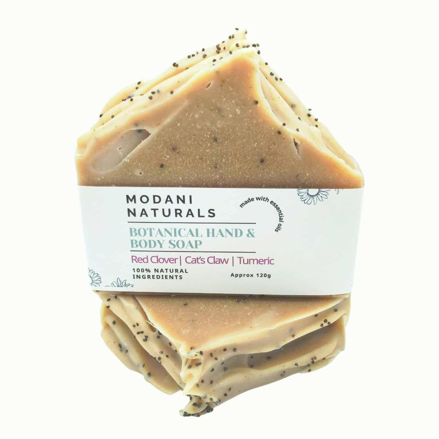 Modani Naturals botanical hand and body soap bar with visible specks on a white background