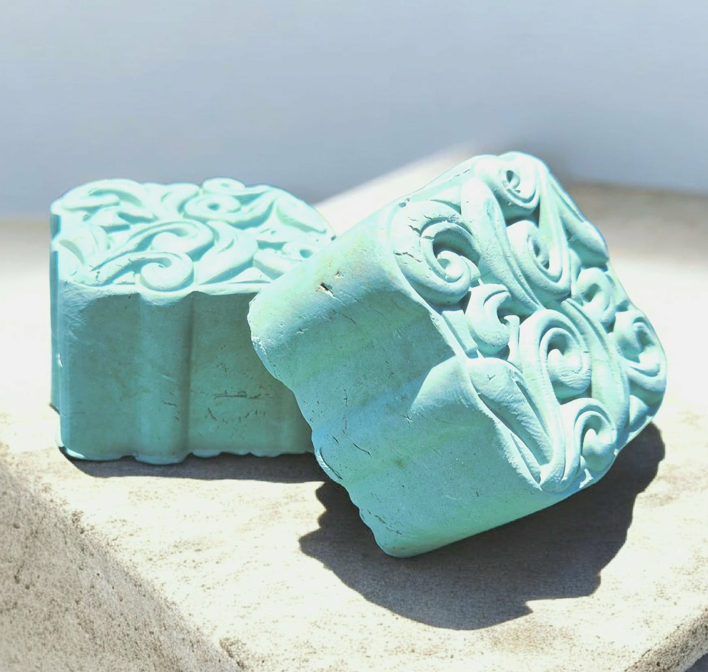 Two Seaweed and blue clay face and body solid mask bar with Modani Naturals packaging on a white background