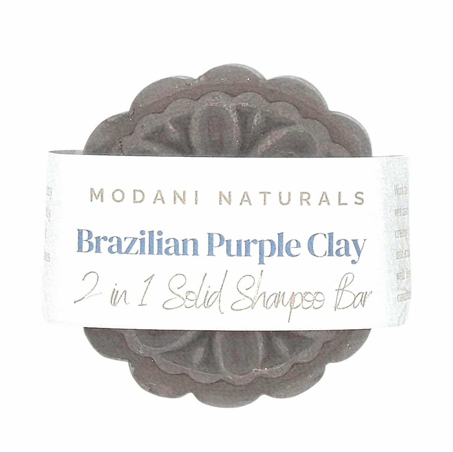 Bar of Brazilian Purple Clay soap with Modani Naturals packaging on a white background