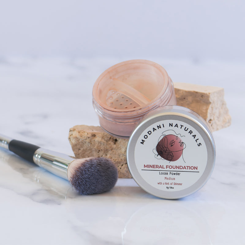 Modani Naturals Mineral Foundation Powder displayed open with makeup brush