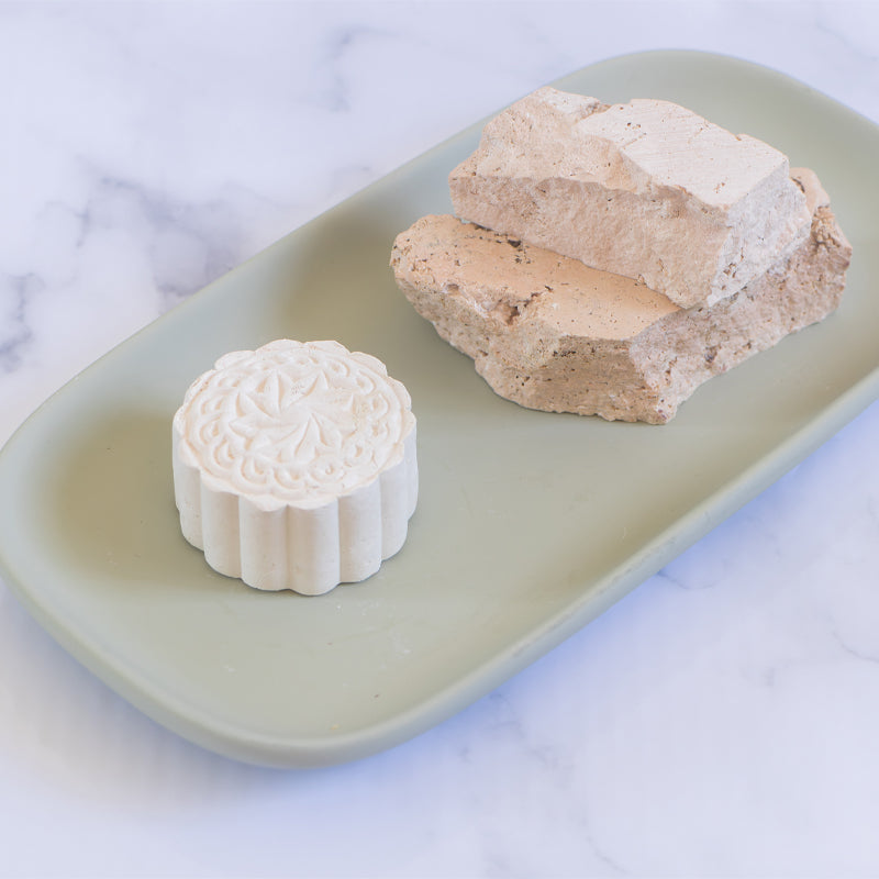Modani Naturals White Clay Mask bar displayed on ceramic tray.