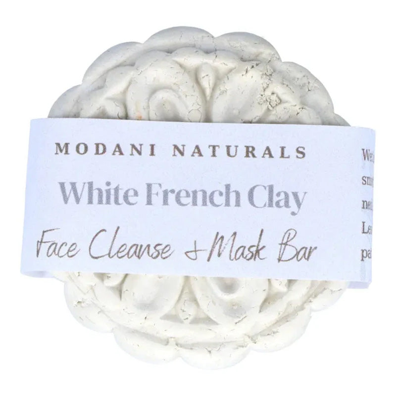 Modani naturals solid face mask bar with label on white background.