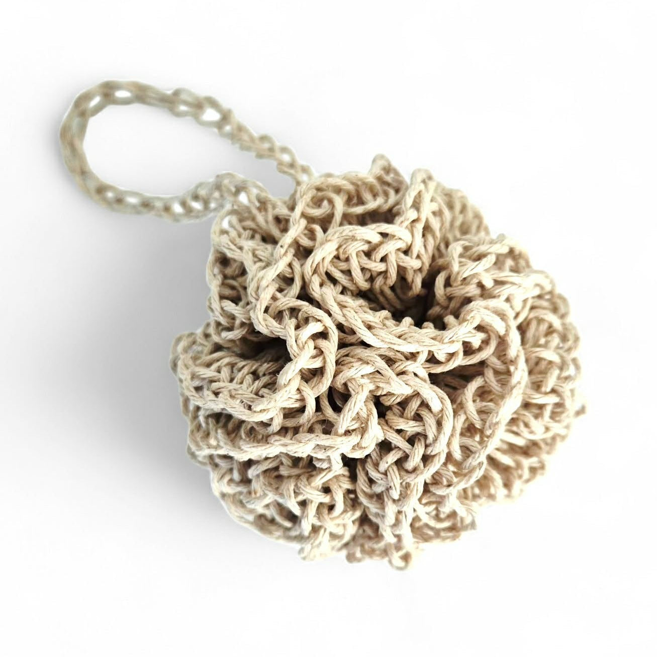 Beige hemp face cleansing pouf with strap on a white background