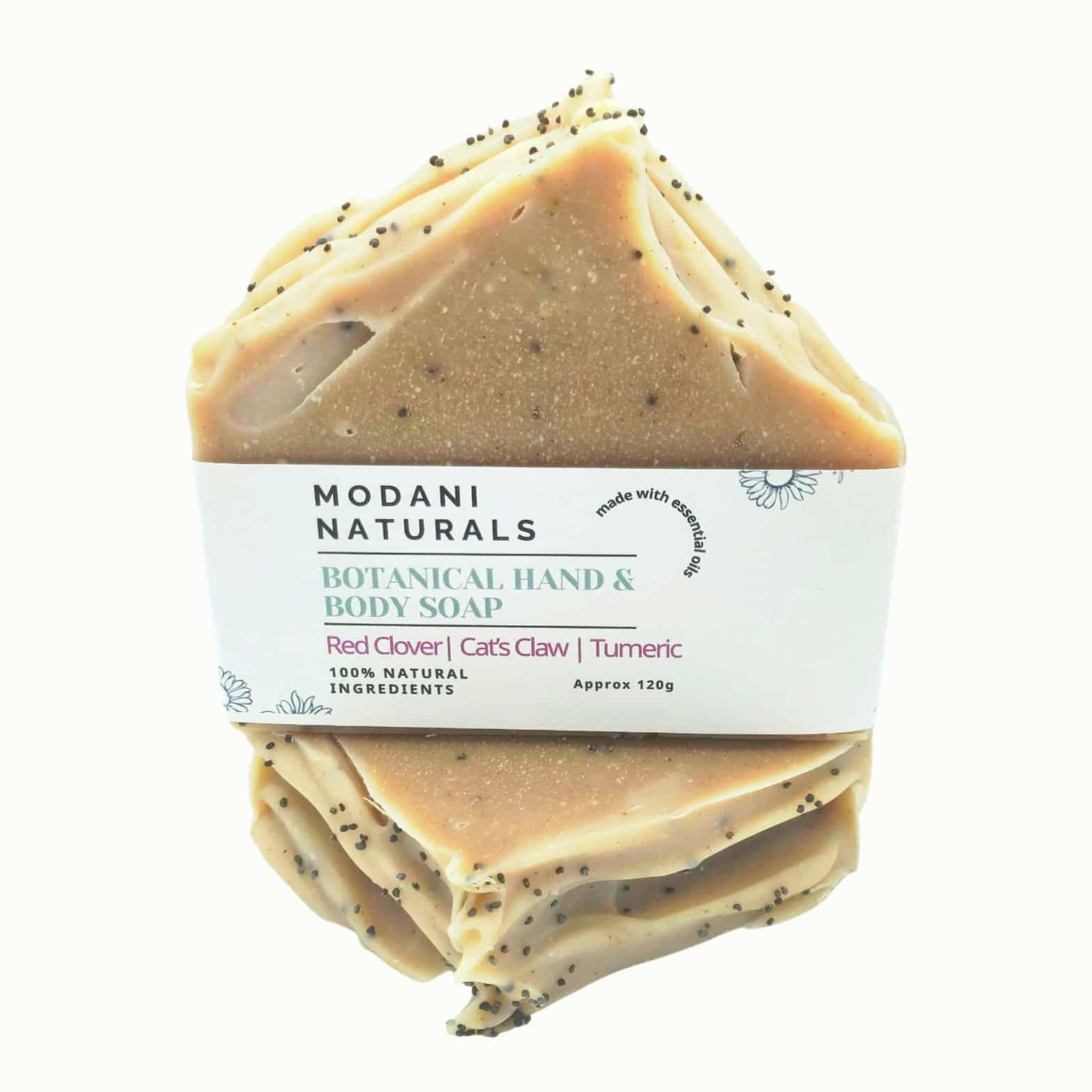 Modani Naturals botanical hand and body soap bar with visible specks on a white background