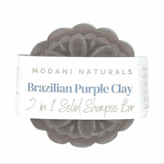 Bar of Brazilian Purple Clay soap with Modani Naturals packaging on a white background