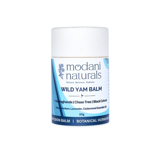 A white cardboard container push up tube of Modani Naturals Wild Yam Balm with a blue and white label, centered on a plain white background.