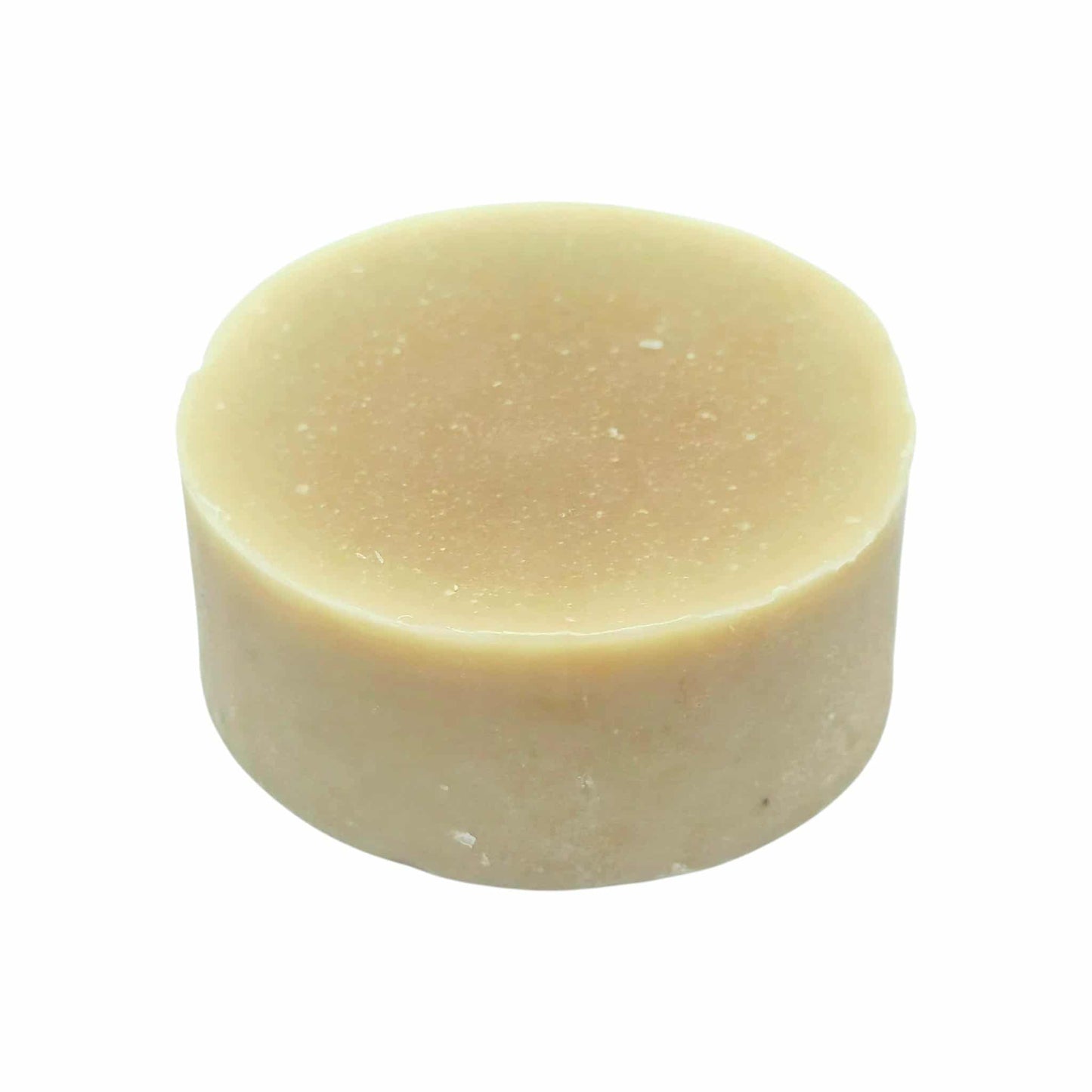 Honey colour bar of botanical soap on a white background