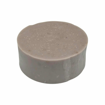 Modani naturals round purple botanical soap on white background. 