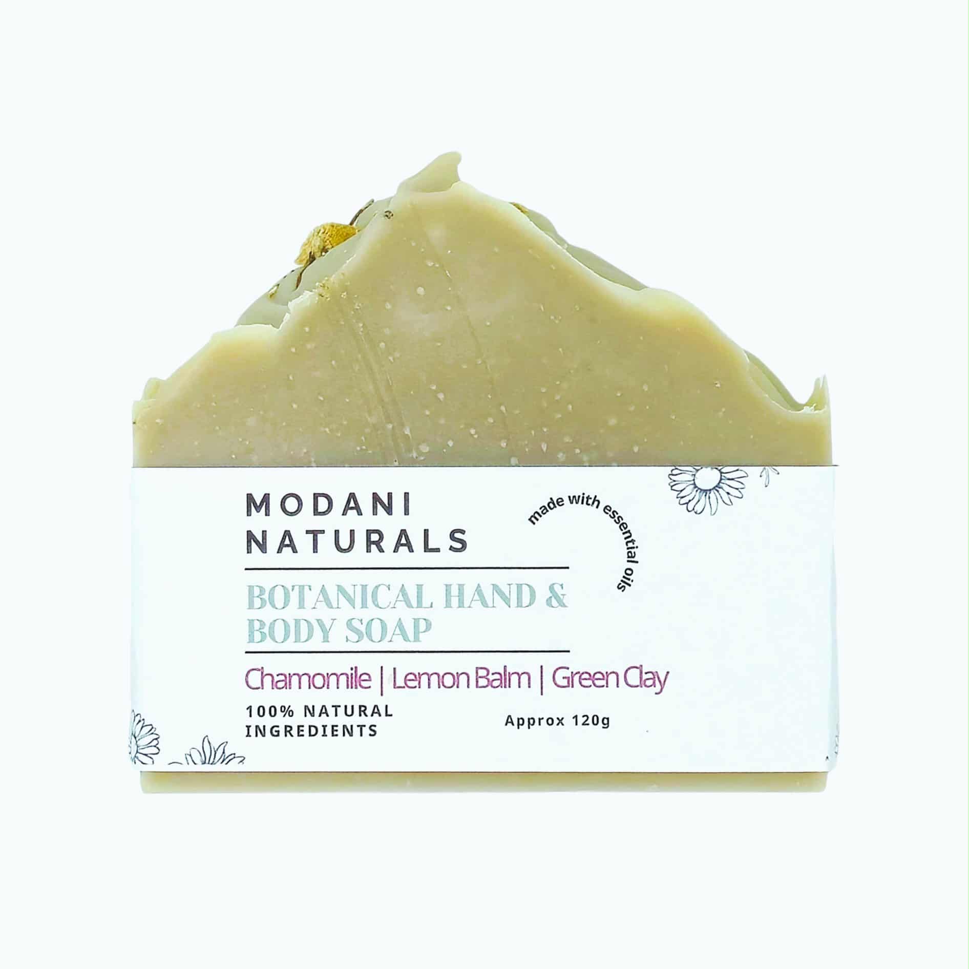Modani Naturals botanical hand and body soap with chamomile, lemon balm, and green clay on a white background