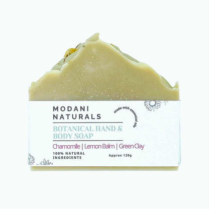 Modani Naturals botanical hand and body soap with chamomile, lemon balm, and green clay on a white background