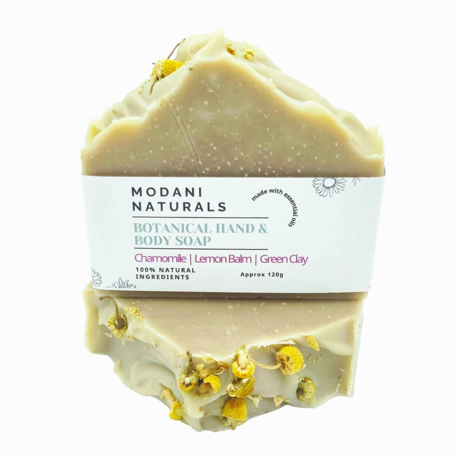 Modani Naturals botanical hand and body soap with visible ingredients on a white background