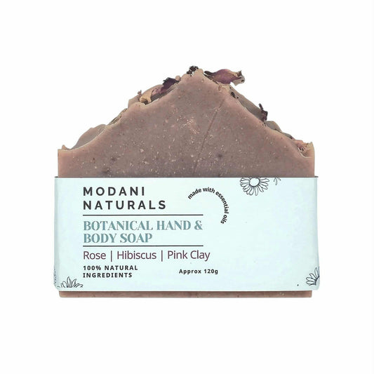 Modani Naturals botanical hand and body soap with rose, hibiscus, and pink clay on a white background